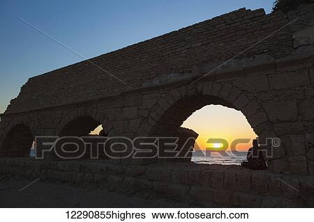 Roman aqueduct with arches at sunset in Caesarea Maritima National Park; Israel View Large Photo Image Stock Photograph - Roman aqueduct with arches at sunset in Caesarea Maritima National Park; Israel. Fotosearch