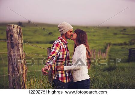 Stock Photograph - Romantic Young Couple in Love Outdoors. Fotosearch