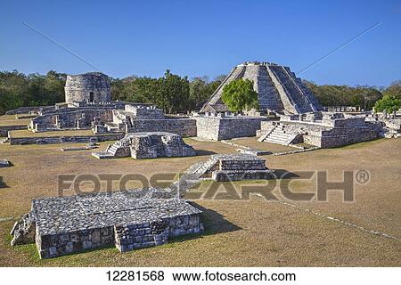 Stock Photo - Round Temple (back, left), Castillo de Kukulcan (back, right), Mayapan Mayan archaeological site; Yucatan, Mexico. Fotosearch