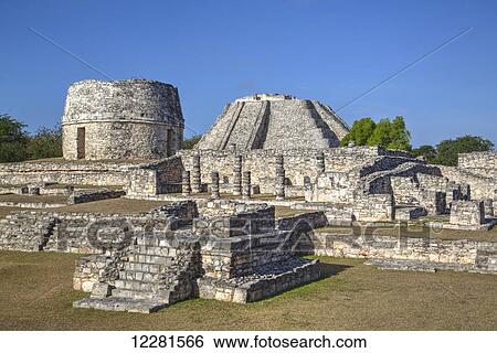 Round Temple, Castillo de Kukulcan (background), Mayapan Mayan archaeological site; Yucatan, Mexico View Large Photo Image Stock Photograph - Round Temple, Castillo de Kukulcan (background), Mayapan Mayan archaeological site; Yucatan, Mexico. Fotosearch