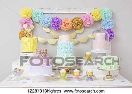 Rows of cupcakes and cakes on dessert table; Toronto, Ontario, Canada View Large Photo Image Stock Photograph - Rows of cupcakes and cakes on dessert table; Toronto, Ontario, Canada. Fotosearch