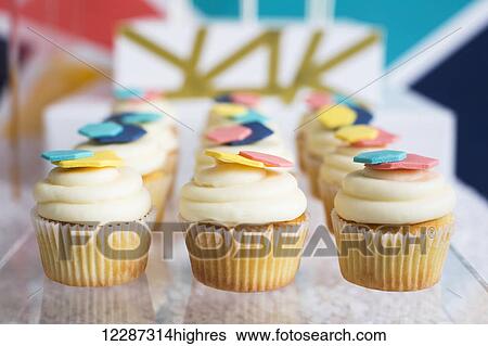 Rows of cupcakes on dessert table; Toronto, Ontario, Canada View Large Photo Image Stock Photograph - Rows of cupcakes on dessert table; Toronto, Ontario, Canada. Fotosearch