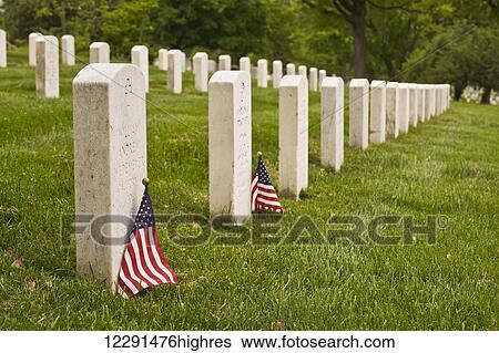 Stock Photograph - Rows of grave stones at Arlington National Cemetery; Arlington, Virginia, United States of America. Fotosearch