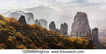 Stock Photograph - Rugged cliffs and a monastery; Meteora, Greece. Fotosearch