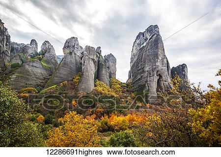 Stock Photograph - Rugged cliffs and autumn foliage; Meteora, Greece. Fotosearch