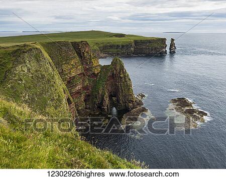 Rugged cliffs and sea stacks along the coastline, Duncansby Head; Scotland View Large Photo Image Stock Photograph - Rugged cliffs and sea stacks along the coastline, Duncansby Head; Scotland. Fotosearch