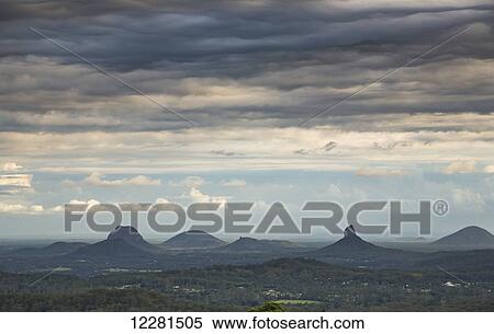 Rugged landscape with peaked mountains; Maleny, Queensland, Australia View Large Photo Image Stock Photography - Rugged landscape with peaked mountains; Maleny, Queensland, Australia. Fotosearch