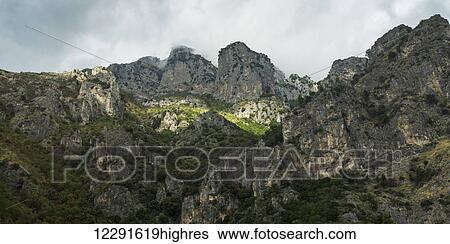 Stock Photograph - Rugged rock cliffs along the Amalfi coast; Amalfi, Italy. Fotosearch