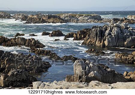 Stock Photograph - Rugged rocks along the California coastline; Monterey, California, United States of America. Fotosearch