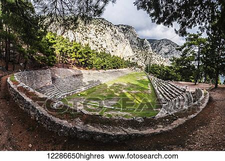 Stock Photograph - Ruins of a racing track and seating; Delphi, Greece. Fotosearch