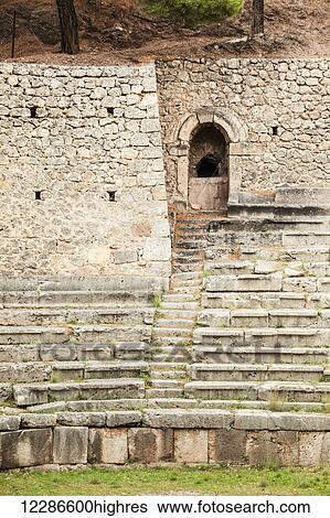 Stock Photograph - Ruins of an ancient stadium and race track; Delphi, Greece. Fotosearch