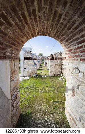 Stock Photograph - Ruins of brick and stone wall and arch; Philippi, Greece. Fotosearch
