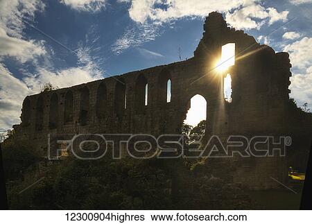 Ruins of Jeraulx Abbey with sunlight shining through a window; Yorkshire Dales, England View Large Photo Image Stock Photograph - Ruins of Jeraulx Abbey with sunlight shining through a window; Yorkshire Dales, England. Fotosearch