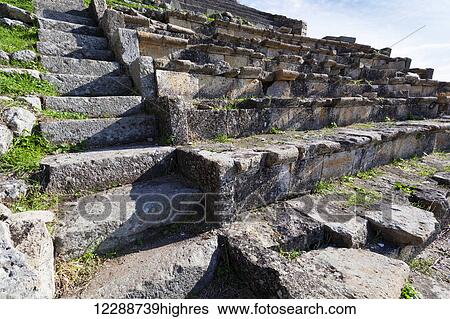 Stock Photograph - Ruins of the steps of a theatre; Pergamum, Turkey. Fotosearch