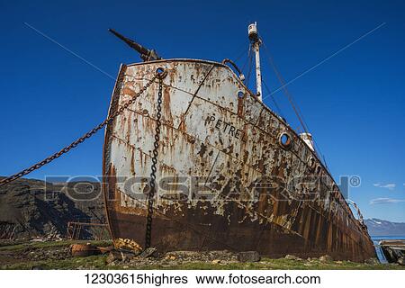 Rusty old whaler chained up beside dock; Antarctica View Large Photo Image Stock Photograph - Rusty old whaler chained up beside dock; Antarctica. Fotosearch