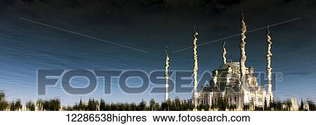 Stock Photograph - Sabanci Mosque reflected in the Seyhan River; Adana, Turkey. Fotosearch