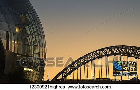 Stock Photograph - Sage Gateshead and the Tyne Bridge at sunset; Gateshead, Tyne and Wear, England. Fotosearch