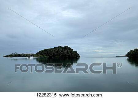 Sailboat docked near a small island near Suva, South pacific; Fiji Island View Large Photo Image Stock Photography - Sailboat docked near a small island near Suva, South pacific; Fiji Island. Fotosearch