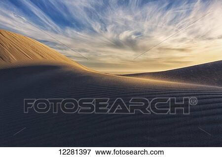 Sand blows towards the camera in the desert of Namakwaland National Park; Namakwa, South Africa View Large Photo Image Stock Photo - Sand blows towards the camera in the desert of Namakwaland National Park; Namakwa, South Africa. Fotosearch