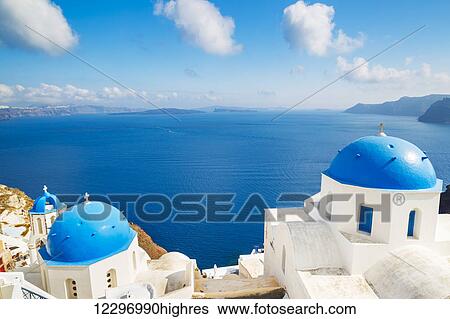Stock Photograph - Santorini Island, Greece, Beautiful View of Blue Ocean and Traditional Dome Church Architecture. Fotosearch