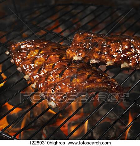 Sauce covered rack of ribs on a grill; Toronto, Ontario, Canada View Large Photo Image Stock Photograph - Sauce covered rack of ribs on a grill; Toronto, Ontario, Canada. Fotosearch