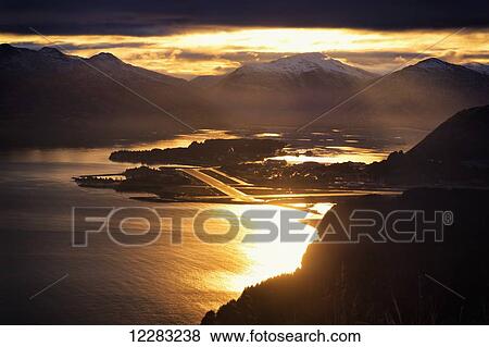 Stock Photo - Scenic view of Benny Benson State airport at Sunset from Pillar Mountain, Southwest Alaska. Fotosearch