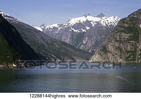 Scenic view of Tracy Arm Fjord with a tour boat heads out, Southeast Alaska, summer View Large Photo Image Stock Photograph - Scenic view of Tracy Arm Fjord with a tour boat heads out, Southeast Alaska, summer. Fotosearch