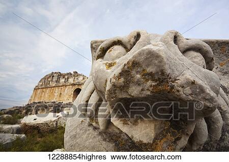 Stock Photograph - Sculpture of a lion at the ruins of an amphitheatre; Miletus, Turkey. Fotosearch