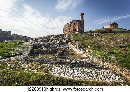 Stock Photograph - Selcuk Castle and mosque with minaret; Ephesus, Turkey. Fotosearch