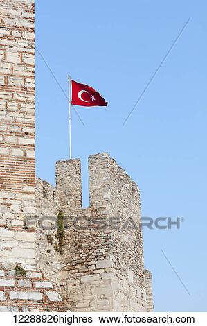 Stock Photograph - Selcuk Castle and the Turkish flag; Ephesus, Turkey. Fotosearch