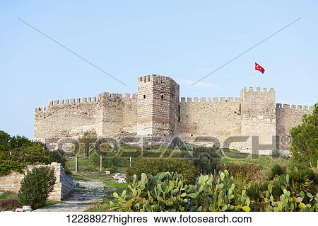 Stock Photograph - Selcuk Castle and the Turkish flag; Ephesus, Turkey. Fotosearch