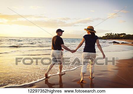 Senior Couple Enjoying Sunset at the Beach View Large Photo Image Stock Photograph - Senior Couple Enjoying Sunset at the Beach. Fotosearch