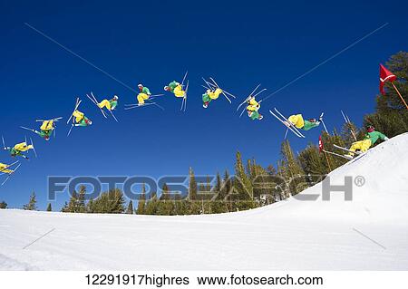 Stock Photograph - Sequence of Skier doing Radical Back Flip off Jump. Fotosearch