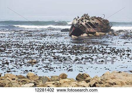 Stock Image - Shipwreck along the South African Coast in the town of Hondeklip Bay; Namakwa, South Africa. Fotosearch
