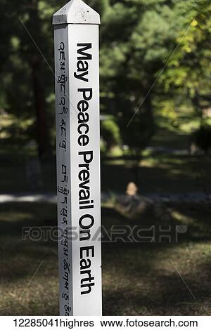 Stock Photograph - Sign post about peace; Paro, Bhutan. Fotosearch