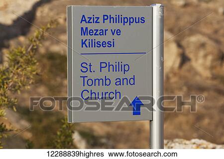 Stock Photograph - Sign with arrow pointing to St Philip tomb and church; Pamukkale, Turkey. Fotosearch