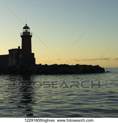 Stock Photograph - Silhouette of a lighthouse; Ischia, Italy. Fotosearch
