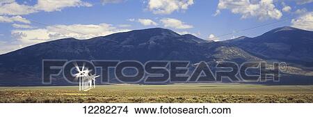 Single row of wind generators with mountains beyond, near Milford; Utah, United States of America View Large Photo Image Picture - Single row of wind generators with mountains beyond, near Milford; Utah, United States of America. Fotosearch