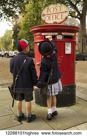 Sister and brother holding hands posting letter; London, England View Large Photo Image Stock Photograph - Sister and brother holding hands posting letter; London, England. Fotosearch
