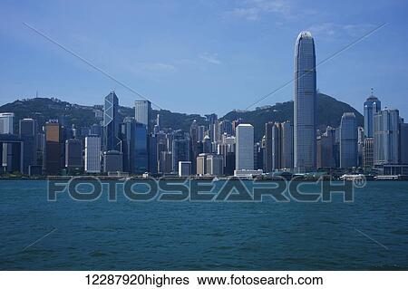 Stock Photograph - Skyline of Hong Kong island from Kowloon; Kowloon, Hong Kong, China. Fotosearch