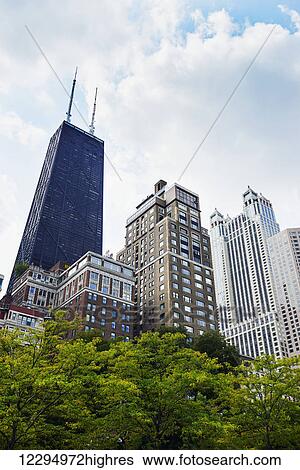 Stock Photograph - Skyline view in Chicago including the John Hancock Centre and 900 North Michigan; Chicago, Illinois, United States of America. Fotosearch