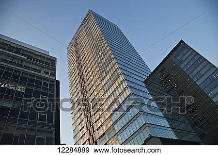 Skyscrapers against a blue sky; Tokyo, Japan View Large Photo Image Stock Photo - Skyscrapers against a blue sky; Tokyo, Japan. Fotosearch