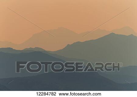 Stock Image - Smoke from wildfires in central Alaska colours the sky, Denali National Park; Alaska, United States of America. Fotosearch