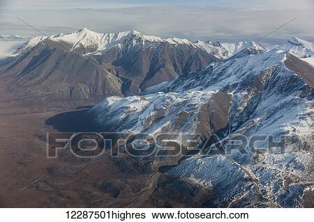 Stock Photograph - Snow covered peaks in the Brooks Range in winter; Alaska, United States of America. Fotosearch