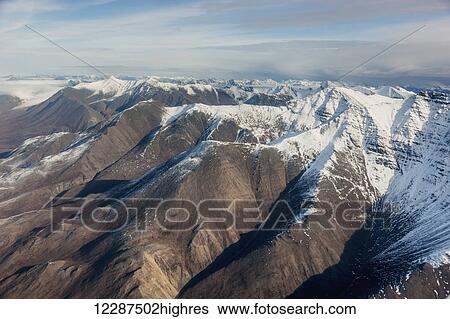 Snow covered peaks in the Brooks Range in winter; Alaska, United States of America View Large Photo Image Stock Photograph - Snow covered peaks in the Brooks Range in winter; Alaska, United States of America. Fotosearch