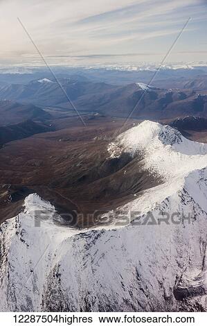 Stock Photograph - Snow covered peaks in the Brooks Range in winter; Alaska, United States of America. Fotosearch