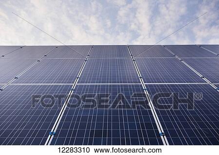 Stock Image - Solar panels in field; Bloomfield, Ontario, Canada. Fotosearch