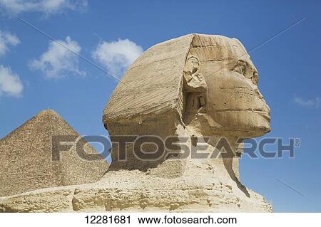 Sphinx (foreground), Great Pyramid of Cheops (background), The Giza Pyramids; Giza, Egypt View Large Photo Image Stock Image - Sphinx (foreground), Great Pyramid of Cheops (background), The Giza Pyramids; Giza, Egypt. Fotosearch