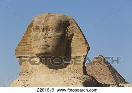 Sphinx (foreground), Pyramid of Mycerinus (background), The Giza Pyramids; Giza, Egypt View Large Photo Image Stock Photo - Sphinx (foreground), Pyramid of Mycerinus (background), The Giza Pyramids; Giza, Egypt. Fotosearch