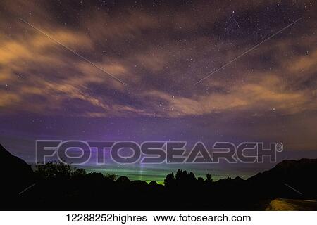 Stars and the Northern Lights (Aurora Borealis) shine through high clouds over Pitt Lake; British Columbia, Canada View Large Photo Image Stock Photograph - Stars and the Northern Lights (Aurora Borealis) shine through high clouds over Pitt Lake; British Columbia, Canada. Fotosearch